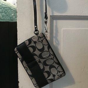 Black and grey Coach wristlet